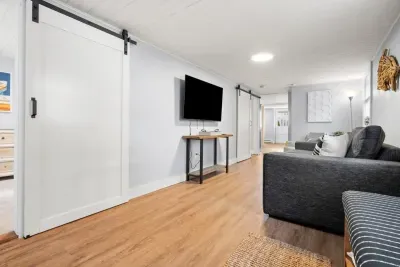 Living room with couch (not a sleeper sofa) and smart Roku TV to enjoy your streaming services and basic cable.