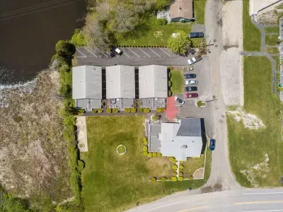 aerial view of "Snug Harbor", across the street from the ocean, large lawn area to relax, sunbath, and walking distance to Wallis Sands