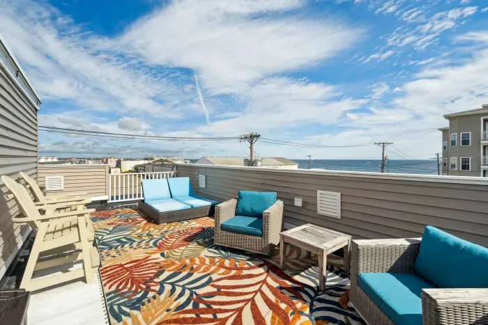Private rooftop deck with ocean views and outdoor seating, perfect for a morning coffee or an afternoon drink!