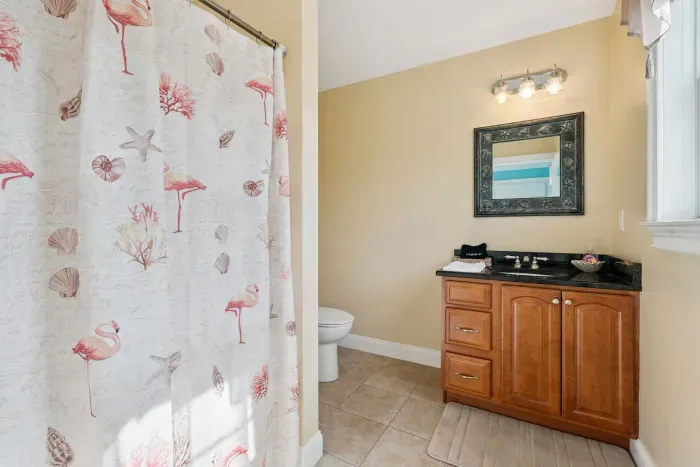 Full bathroom located off the kitchen