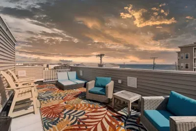 Private rooftop deck with ocean views and outdoor seating, perfect for a morning coffee or an afternoon drink!