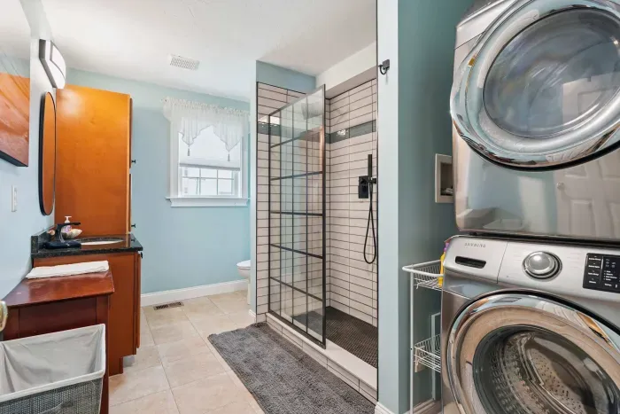 Full bathroom located on the second floor with washer and dryer.