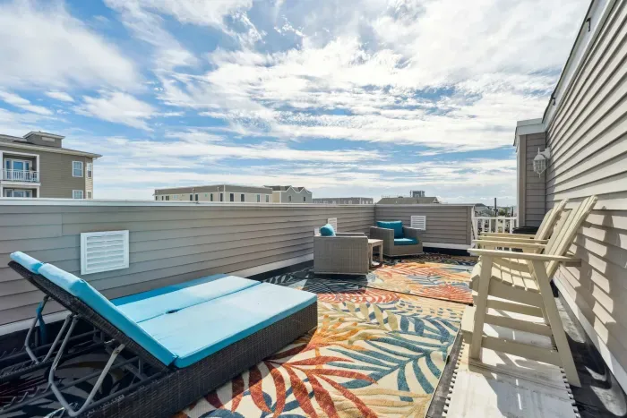 Private deck with ocean views and outdoor seating, perfect for a morning coffee or afternoon drink.