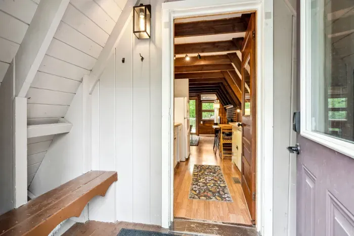The mudroom! This room is not heated but is the perfect place to store winter jackets, shoes, and skis in the built in racks!