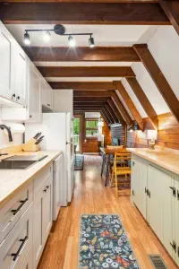 The kitchen is fully equipped with all the essentials, like cookware, plates, moka espresso pot, tea kettle, drip coffee, utensils, and a dishwasher!