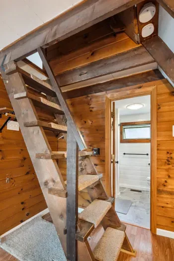 PLEASE READ: these stairs/ladder are the only access to the upstairs bedrooms. If a member of your party has mobility challenges this  property may not be the best fit. 