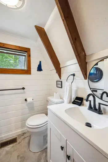 The bathroom! This bathroom has an apartment sized washer and dryer and standing shower. Clean bath and hot tub towels provided for all guests. 