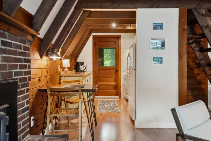 The kitchen and dining area! Please note the dining area is small, there are two additional folding chairs by the stairs if you need additional dining seating. 