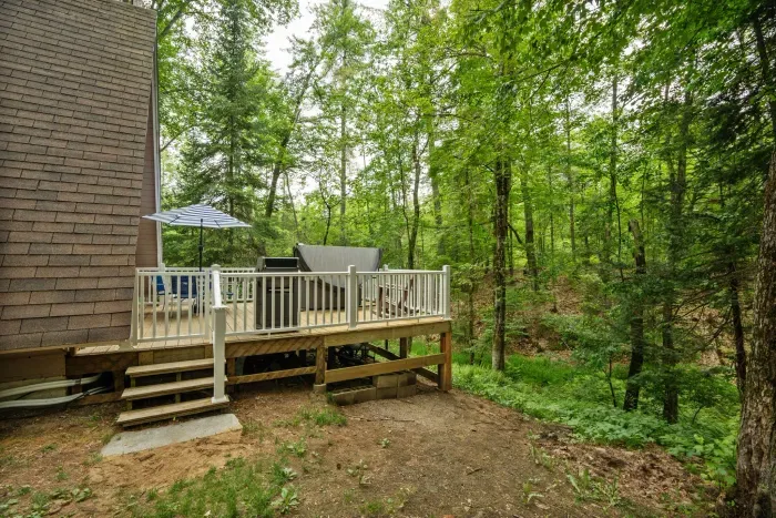 The deck overlooking the stream and woods! Please note there are neighbors on this side of the house. They are very nice! 