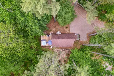 An aerial view of Camp Conway. PLEASE NOTE this home is not secluded in the woods. There are neighbors on each side of the home.