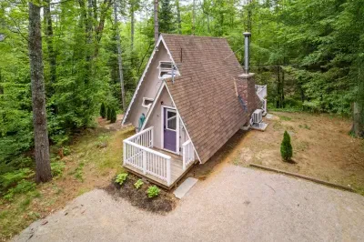 Welcome to Camp Conway! The driveway has parking for 3 small cars or 2 larger ones. PLEASE NOTE that this home does have neighbors on each side of the home.