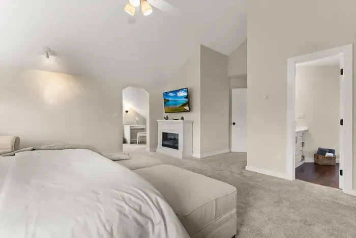 king-size bed, a flat-screen TV, an elegant electric fireplace, and a private ensuite bathroom. Enjoy a peaceful and rejuvenating sleep in this cozy haven.
