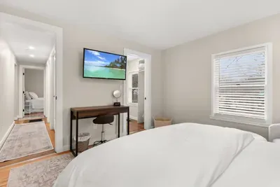 This is a cozy 1st-floor bedroom furnished with a comfortable queen-size bed.