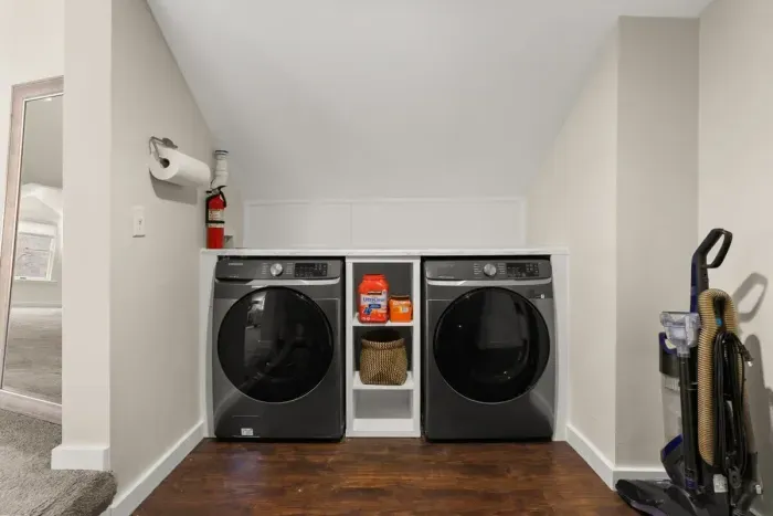 Washer and dryer conveniently located on the second floor, adjacent to the master bedroom.