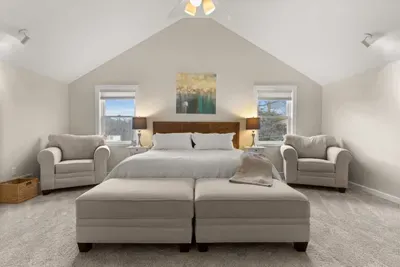 king-size bed, a flat-screen TV, an elegant electric fireplace, and a private ensuite bathroom. Enjoy a peaceful and rejuvenating sleep in this cozy haven.