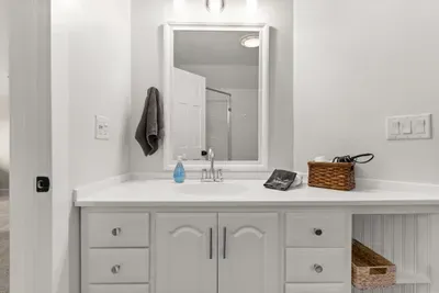 This ensuite bathroom is situated in the master bedroom and features a standing shower.