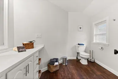 This ensuite bathroom is situated in the master bedroom and features a standing shower.