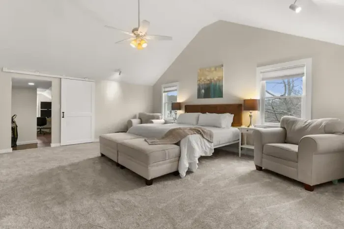 King-size bed, a flat-screen TV, an elegant electric fireplace, and a private ensuite bathroom. Enjoy a peaceful and rejuvenating sleep in this cozy haven.