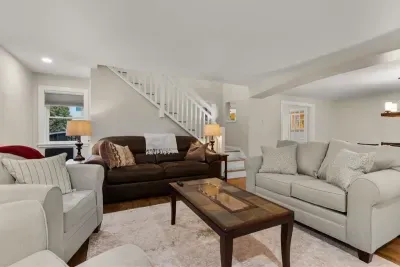 Relax and unwind in our cozy living room, complete with comfortable seating and a large TV for your entertainment.