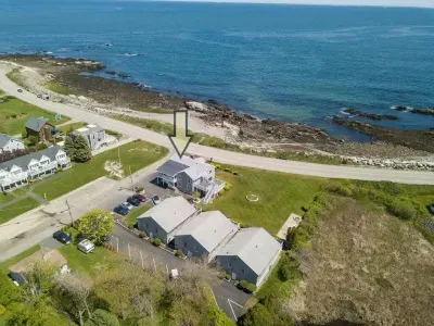 aerial view of "Snug Harbor", across the street from the ocean, large lawn area to relax, sunbath, and walking distance to Wallis Sands
