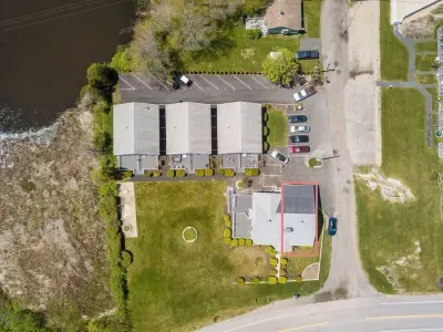 aerial view of "Snug Harbor", across the street from the ocean, large lawn area to relax, sunbath, and walking distance to Wallis Sands