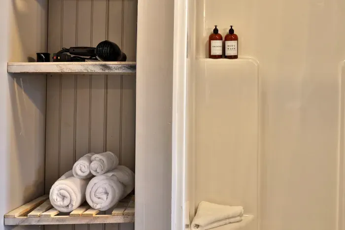 Standing shower includes shampoo and body wash and complimentary towels.