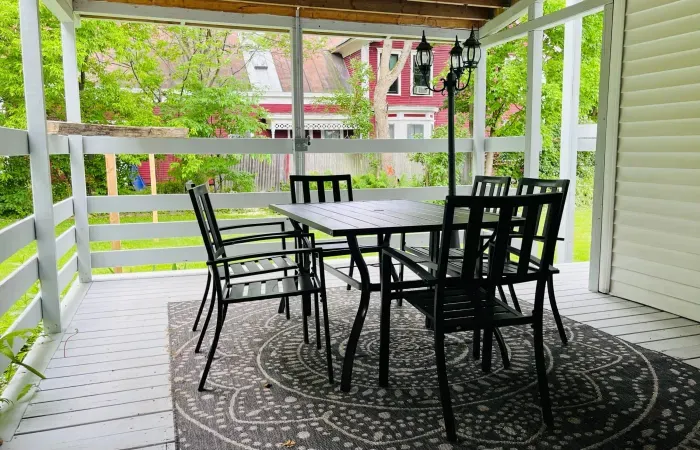 Screened-in porch with dining table