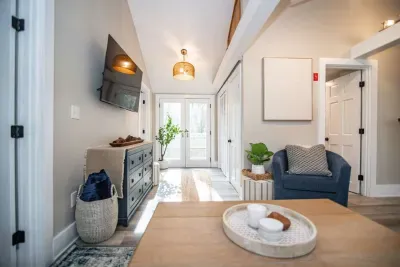 Open concept living room with a brand new sleeper sofa and Smart TV
