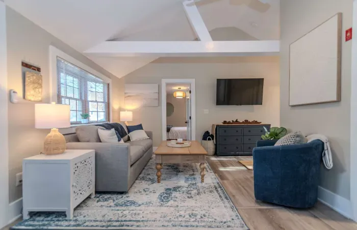 Open concept living room with a brand new sleeper sofa and Smart TV