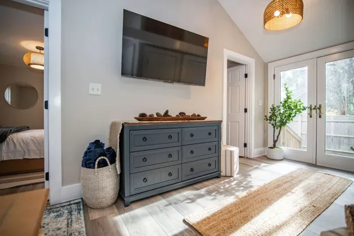 Open concept living room with a brand new sleeper sofa and Smart TV