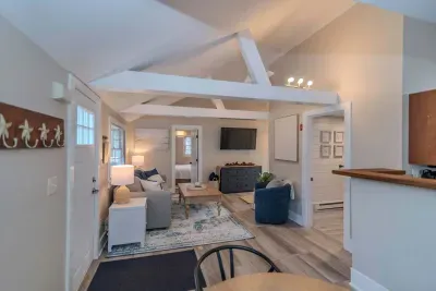 Open concept living room with a brand new sleeper sofa and Smart TV