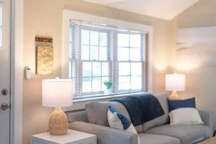 Open concept living room with a brand new sleeper sofa and Smart TV