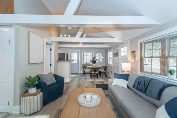 Open concept living room with a brand new sleeper sofa and Smart TV