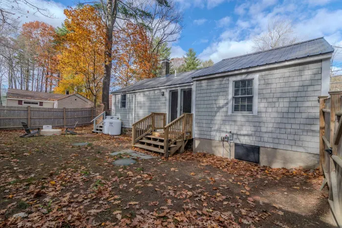 The fenced-in backyard! Perfect for your furry friend! Also featuring a gas fire-pit.