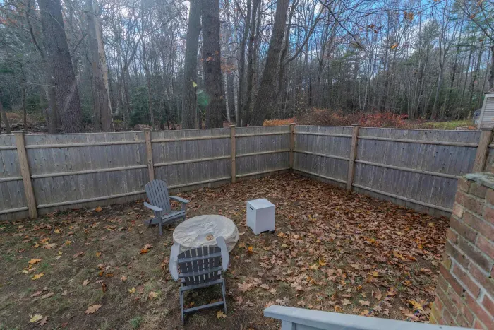 The fenced-in backyard! Perfect for your furry friend! Also featuring a gas fire-pit.