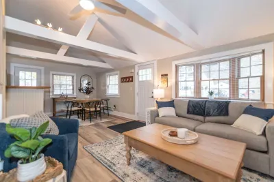 Open concept living room with a brand new sleeper sofa and Smart TV