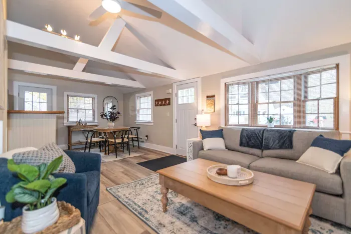 Open concept living room with a brand new sleeper sofa and Smart TV