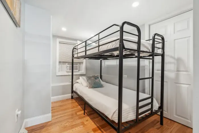 Bedroom #3 with twin-over-twin bunk bed and washer/dryer unit