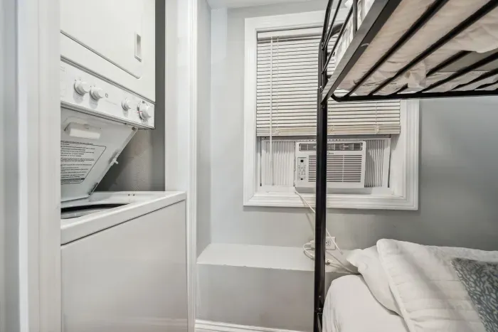Bedroom #3 with twin-over-twin bunk bed and washer/dryer unit
