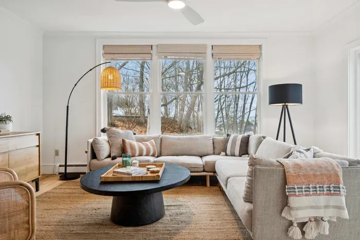 Living area with plenty of natural light, an ocean breeze, and access to the back deck.
