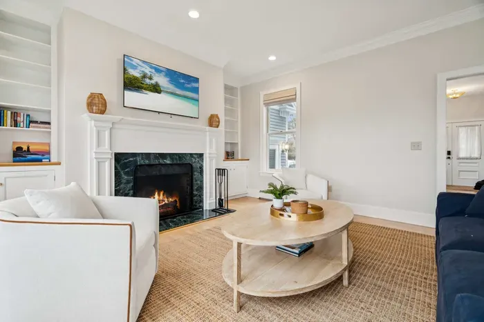 Second living room with a queen sleeper sofa and smart tv. PLEASE NOTE: THE FIREPLACE IS INOPERABLE AND IS NOT TO BE USED