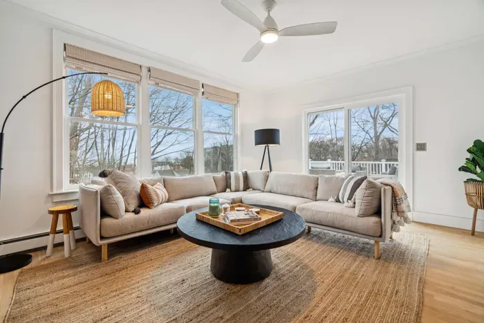Living area with plenty of natural light, an ocean breeze, and access to the back deck.