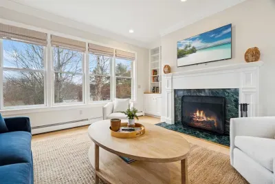 Second living room with a queen sleeper sofa and smart tv. PLEASE NOTE: THE FIREPLACE IS INOPERABLE AND IS NOT TO BE USED