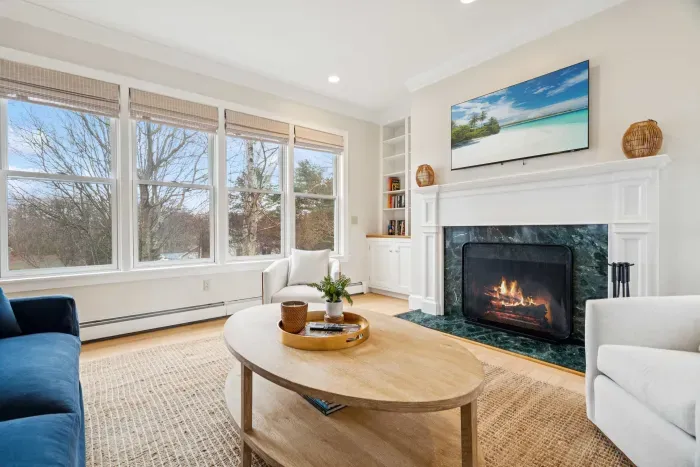 Second living room with a queen sleeper sofa and smart tv. PLEASE NOTE: THE FIREPLACE IS INOPERABLE AND IS NOT TO BE USED