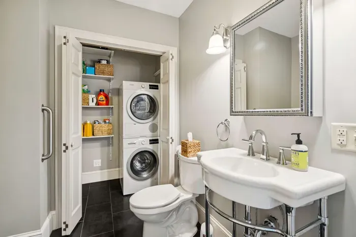 Bathroom #1 located off the kitchen downstairs, there is a standing shower to the left not pictured. Clean towels provided.