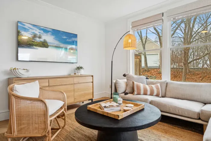 Living area with plenty of natural light, an ocean breeze, and access to the back deck.