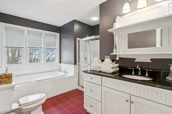 Master bathroom featuring a soaking tub and a stand up shower. Clean towels provided.