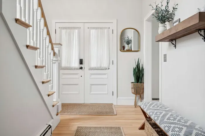 Entryway and stairs leading to the bedrooms