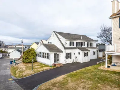 Street view of the home with the new driveway and hardscaping!