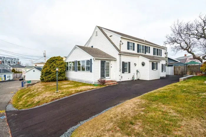 Street view of the home with the new driveway and hardscaping!